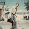 MSF, age 18 waiting for a bus to USAF bootcamp at the Eau Claire, WI bus station.
This degrading photo depicts MSF mimicking his elderly father, his cane in hand.